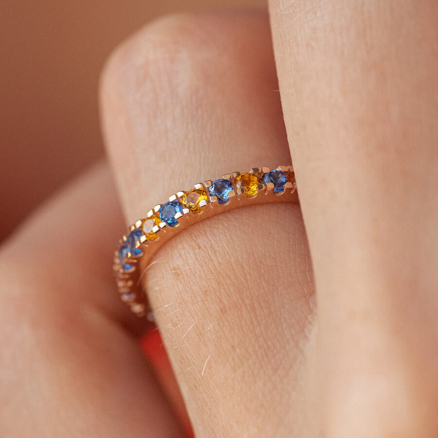 Кольцо с дорожкой голубых и желтых камней (красное золото) 815к