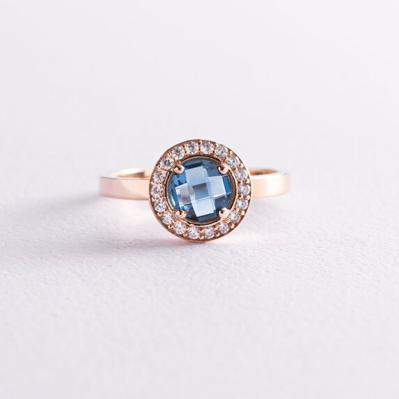 Золотое кольцо с голубым и белыми фианитами к06840
