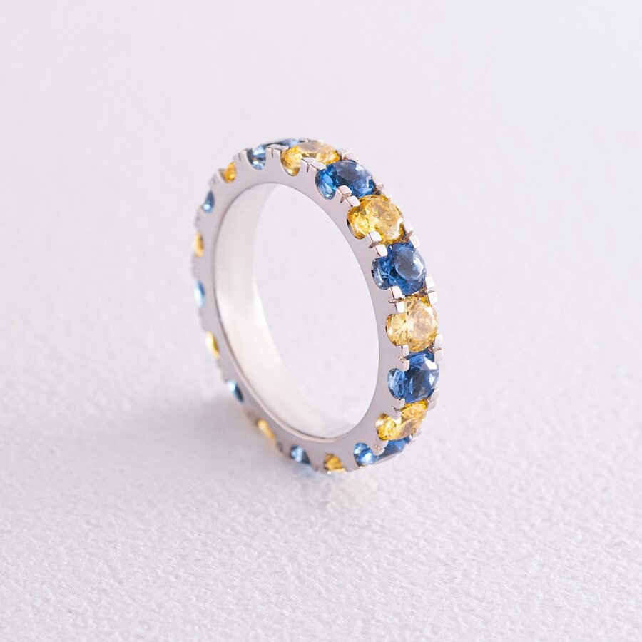Кольцо с дорожкой голубых и желтых камней (белое золото) к07108