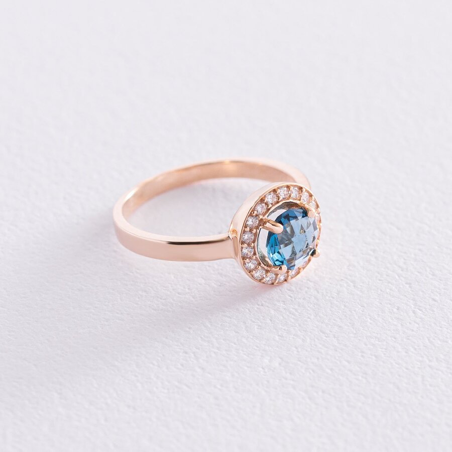 Золотое кольцо с голубым и белыми фианитами к06841